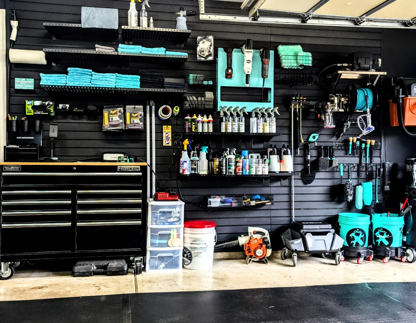 An organized garage studio equipped with detailing products and tools
