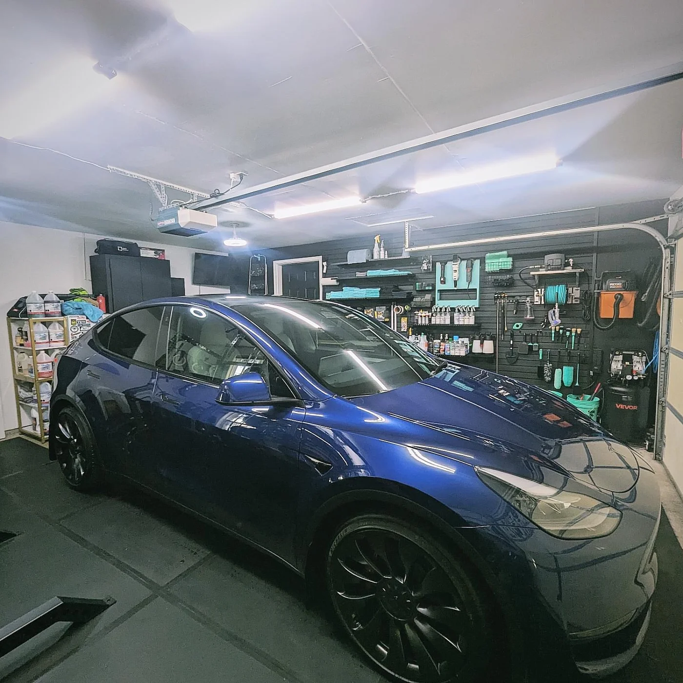 Blue vehicle inside the Double Mint detailing studio